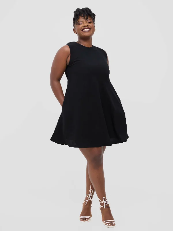 Mini dresses with criss - cross backs for a flirty look Kanini Mini Dress - Black