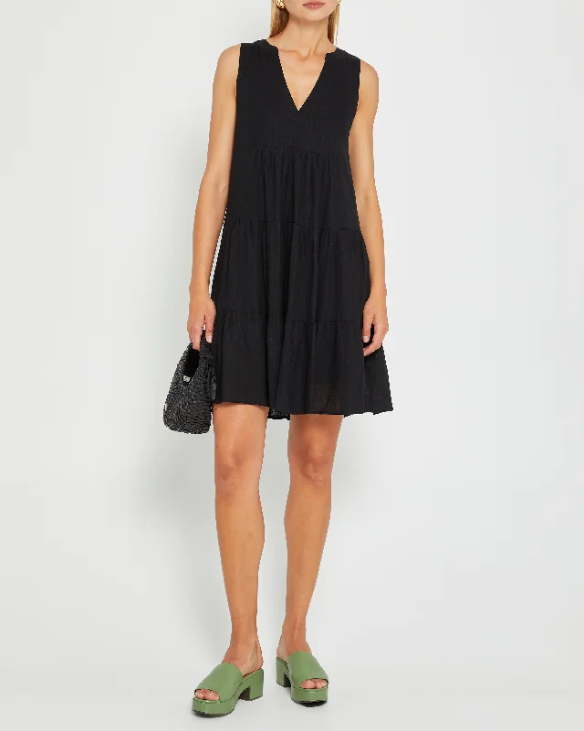 Midi dresses with pom - pom trims for a playful and festive lookMiller Dress