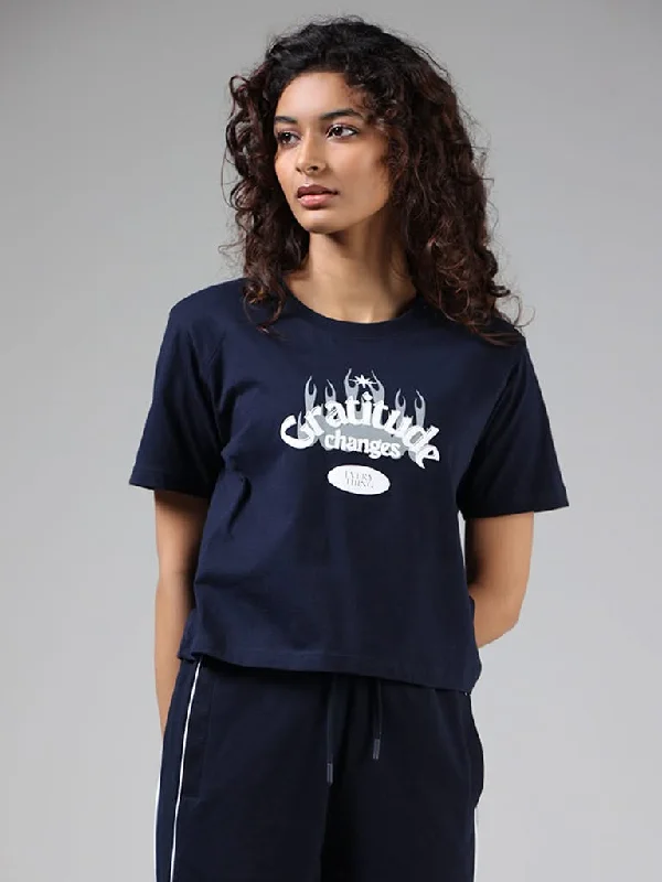 Women's pants for music festivals Ripped women jeans for a rebellious and fashion - forward style Studiofit Navy Blue Typographic Printed Cotton T-Shirt Women's pants for music festivals Ripped women jeans for a rebellious and fashion - forward style Studiofit Navy Blue Typographic Printed Cotton T-Shirt