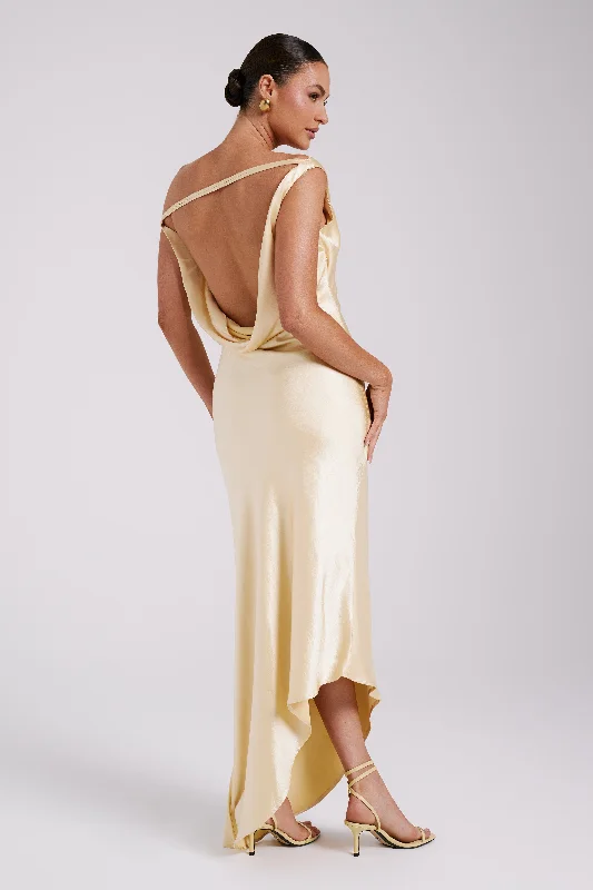 Ruffled maxi dresses with a tiered skirt for added volumeYvette Slip Maxi Dress With Asymmetrical Hem - Butter Ruffled maxi dresses with a tiered skirt for added volumeYvette Slip Maxi Dress With Asymmetrical Hem - Butter